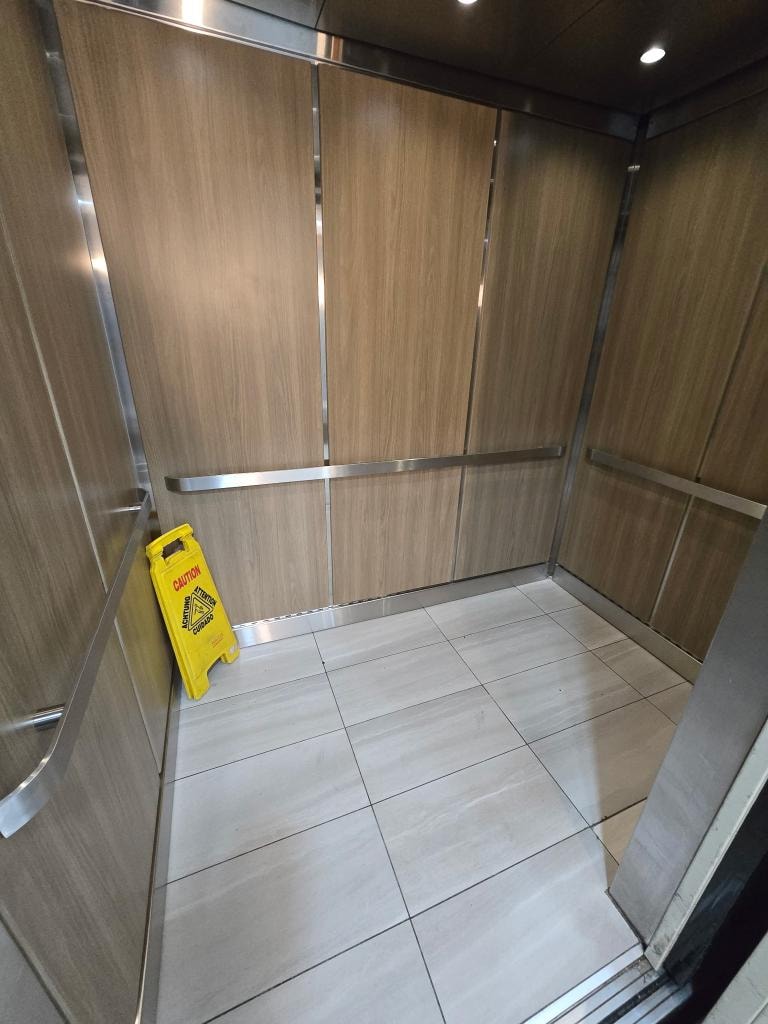 Elevator cab interior upgrade — new wall panels, flooring, and fixtures