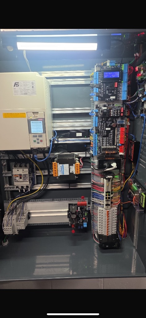 Elevator control panel modernization — new drive system and relay logic installed